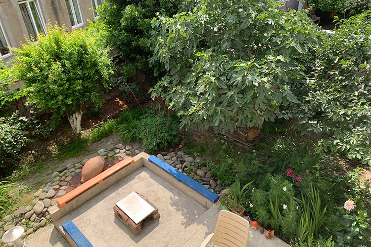 The Why Me garden with fireplace